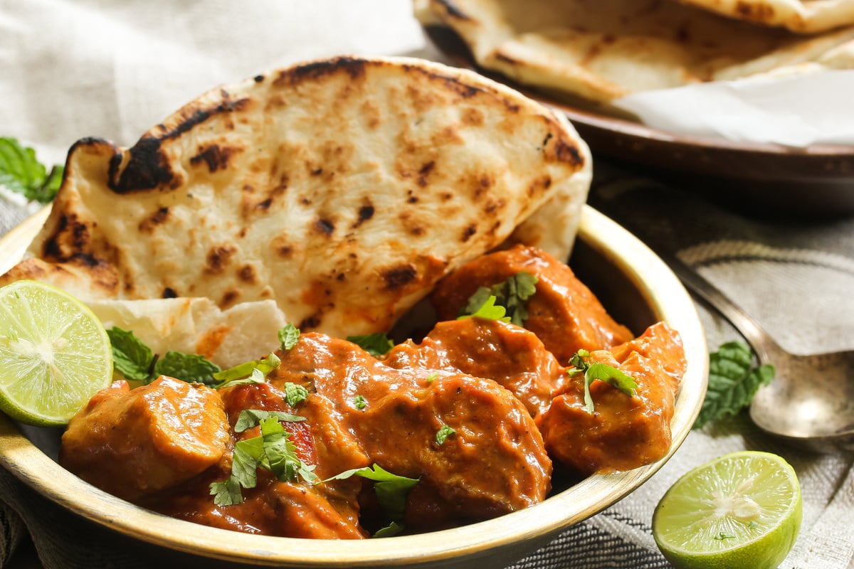 Butter Chicken Served with Homemade Indian Naan Bread